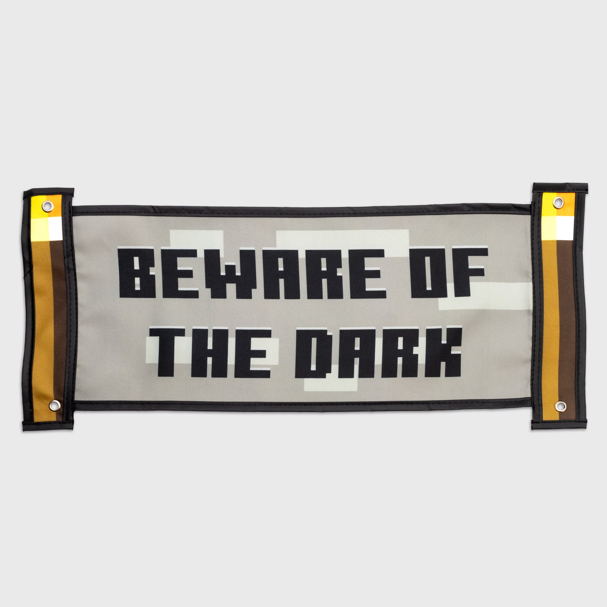 tapestry. ends are torches. middle is rock. text: beware of the dark