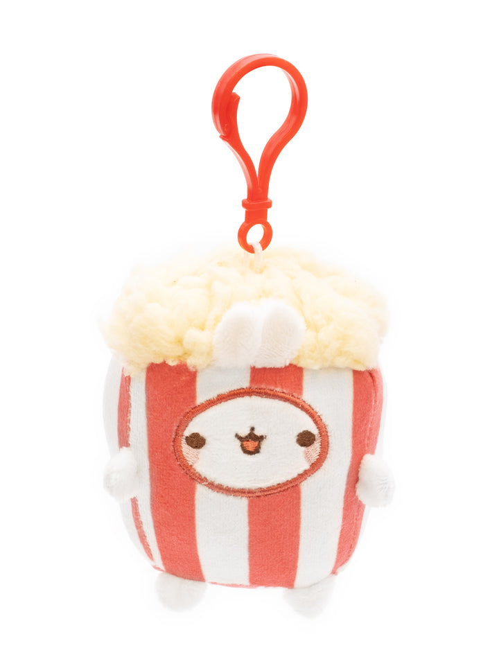 Plush toy resembling a popcorn container with a face on a white background