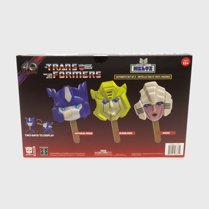 back of packaging. showing all 3 meltz. text: the transformers heroic autobot more than meets the eye! culturefly meltz. ages 13+. autobots set of 3 - metallic meltz vinyl figures. two ways to display. optimus prime. bumblebee. arcee.