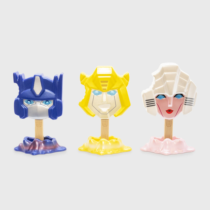 metallic transformers autobots 3 set standing up on stands. optimus prime, bumblebee, acree