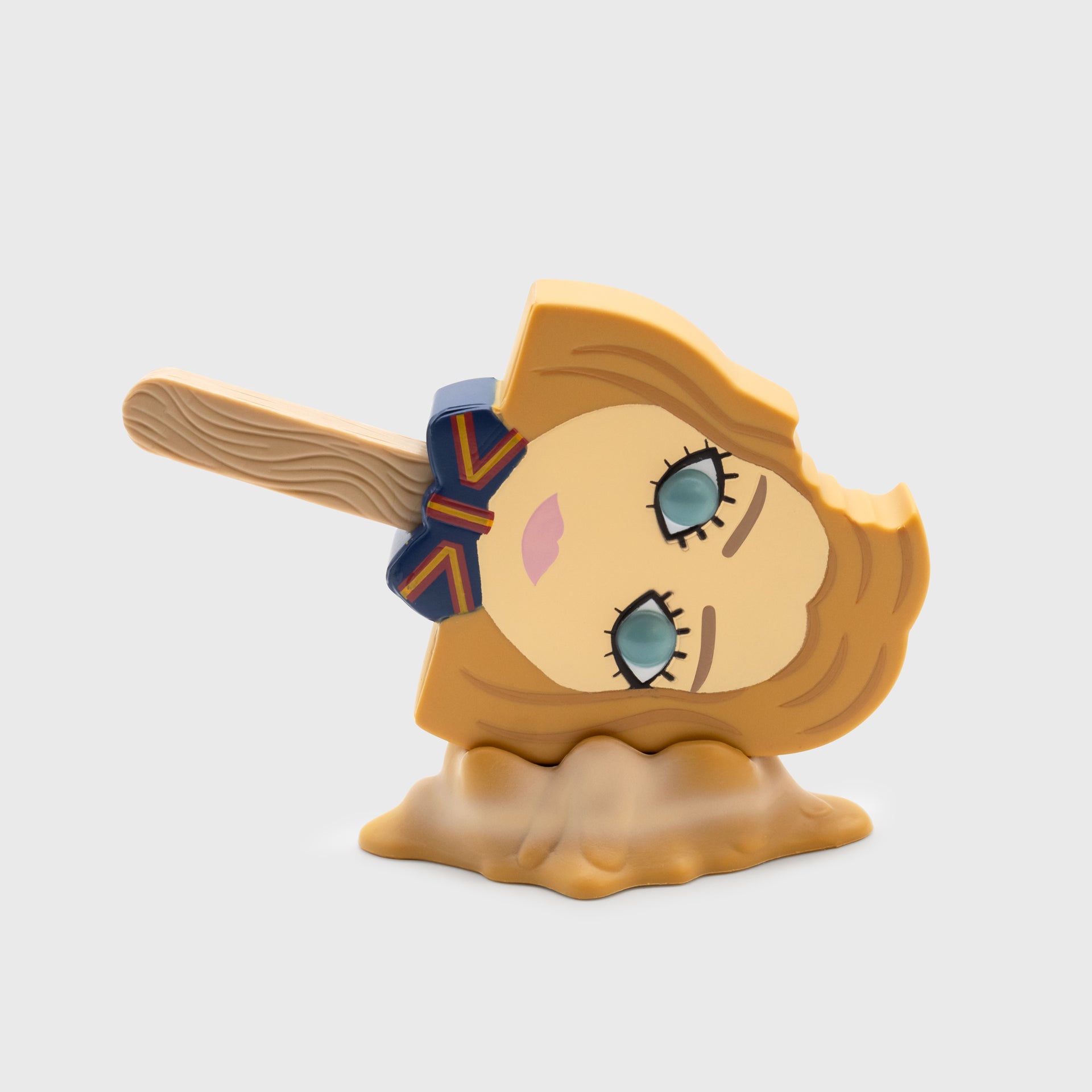 m3gan meltz figure on side on stand