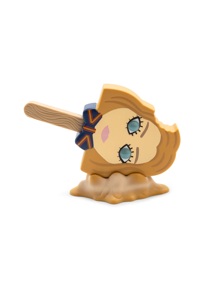 Decorative head with blonde hair, blue eyes, and a brown hair on a white background