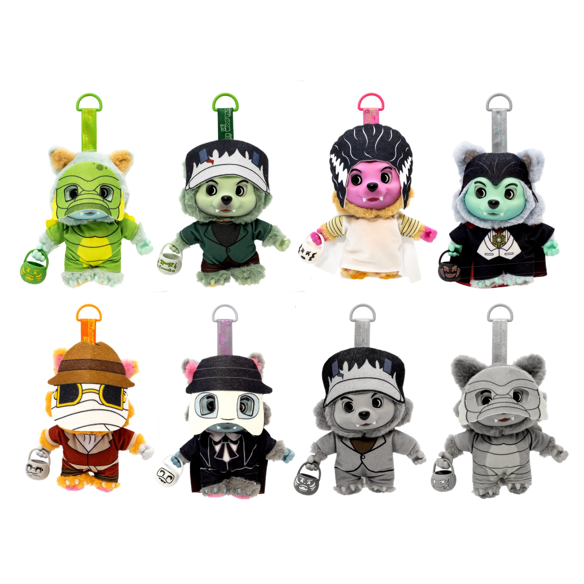 Nine plush character keychain bags arranged in a 3x3 grid on a plain white background. Each plush has a small animal-like body, a colorful costume, and a metal key ring at the top.