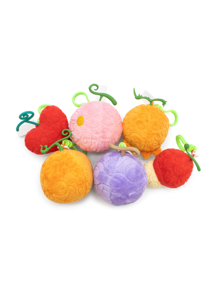 Colorful fruit-shaped toys on a white background