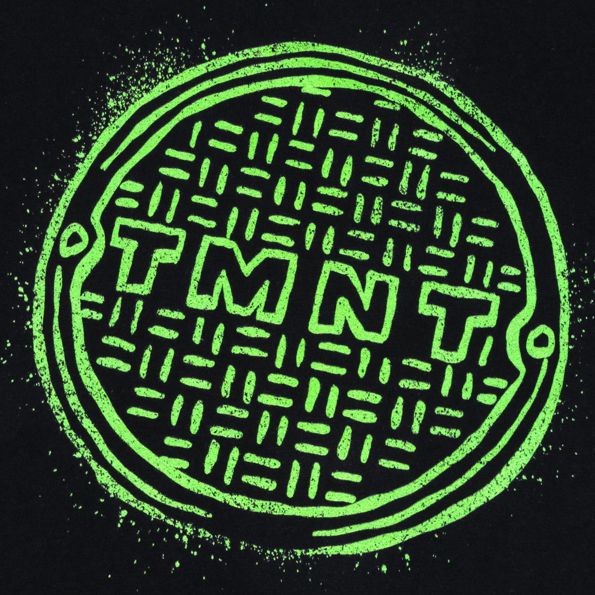 image on shirt: manhole cover. text: tmnt