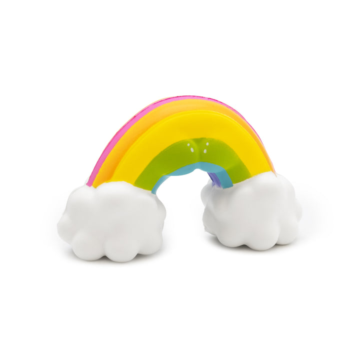 Colorful rainbow toy with white clouds on a white background