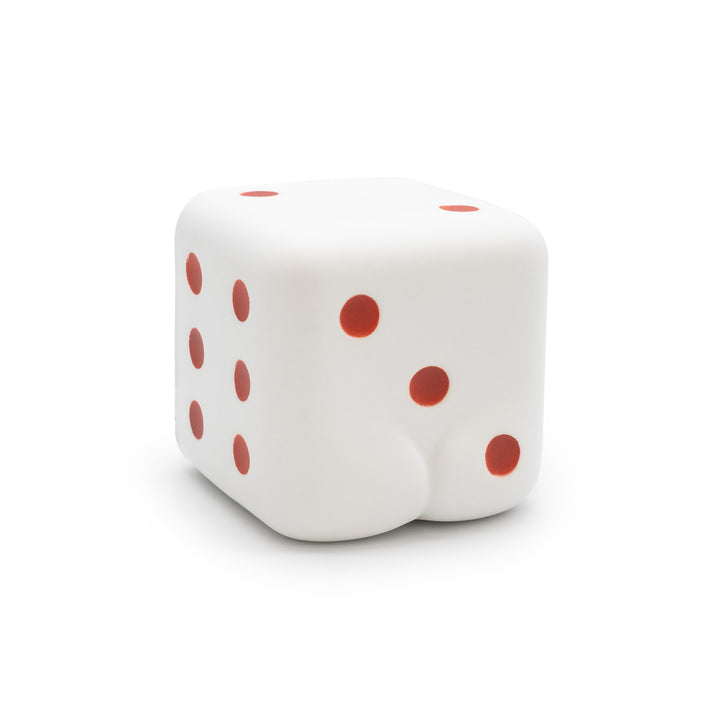 White die with red dots on a white background