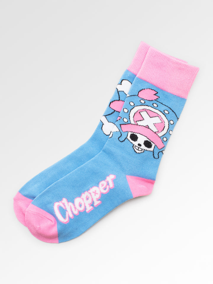 Blue sock with pink accents featuring a cartoon character on a light gray background