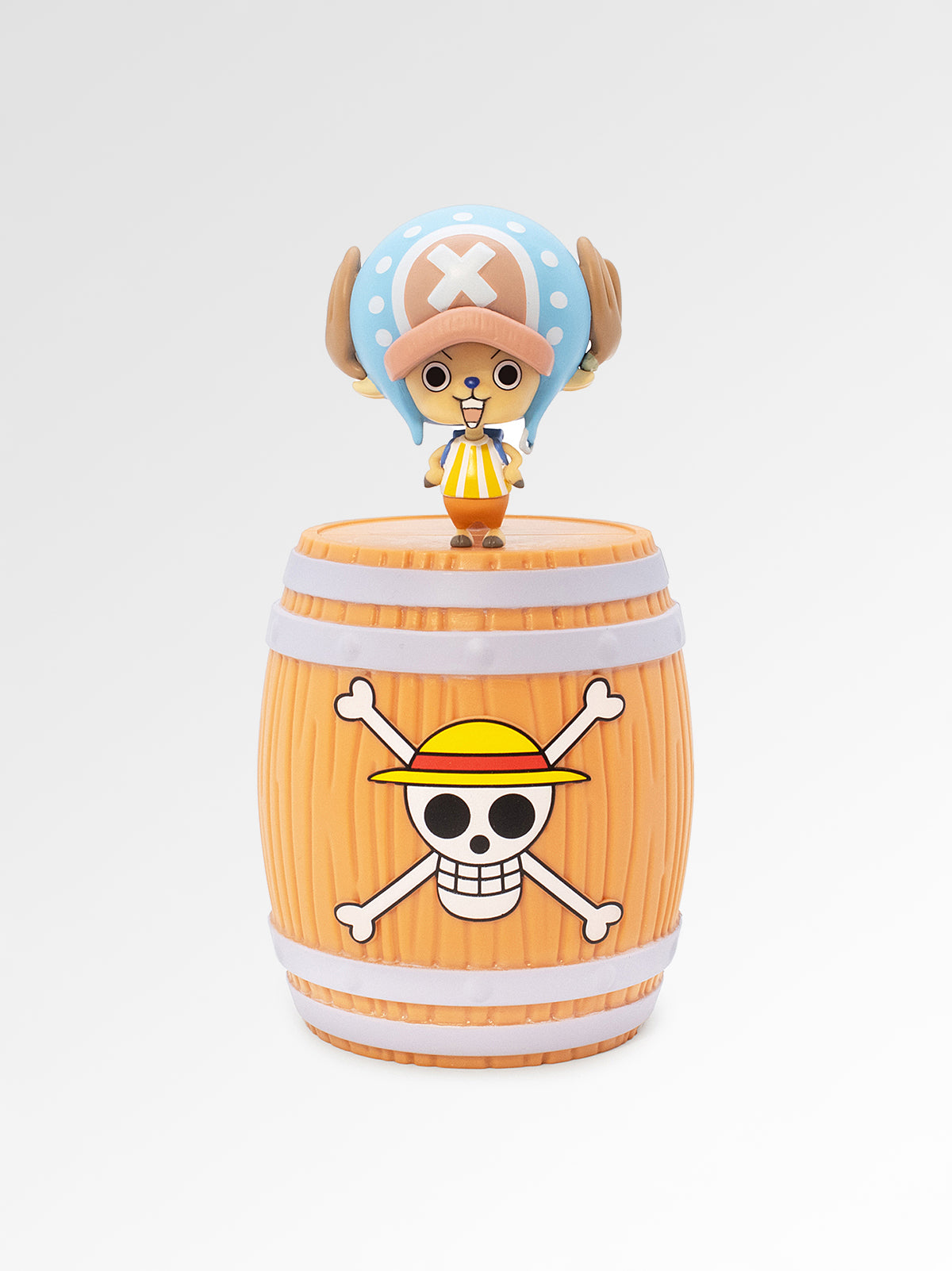 Toy figure on a barrel with character design, white background