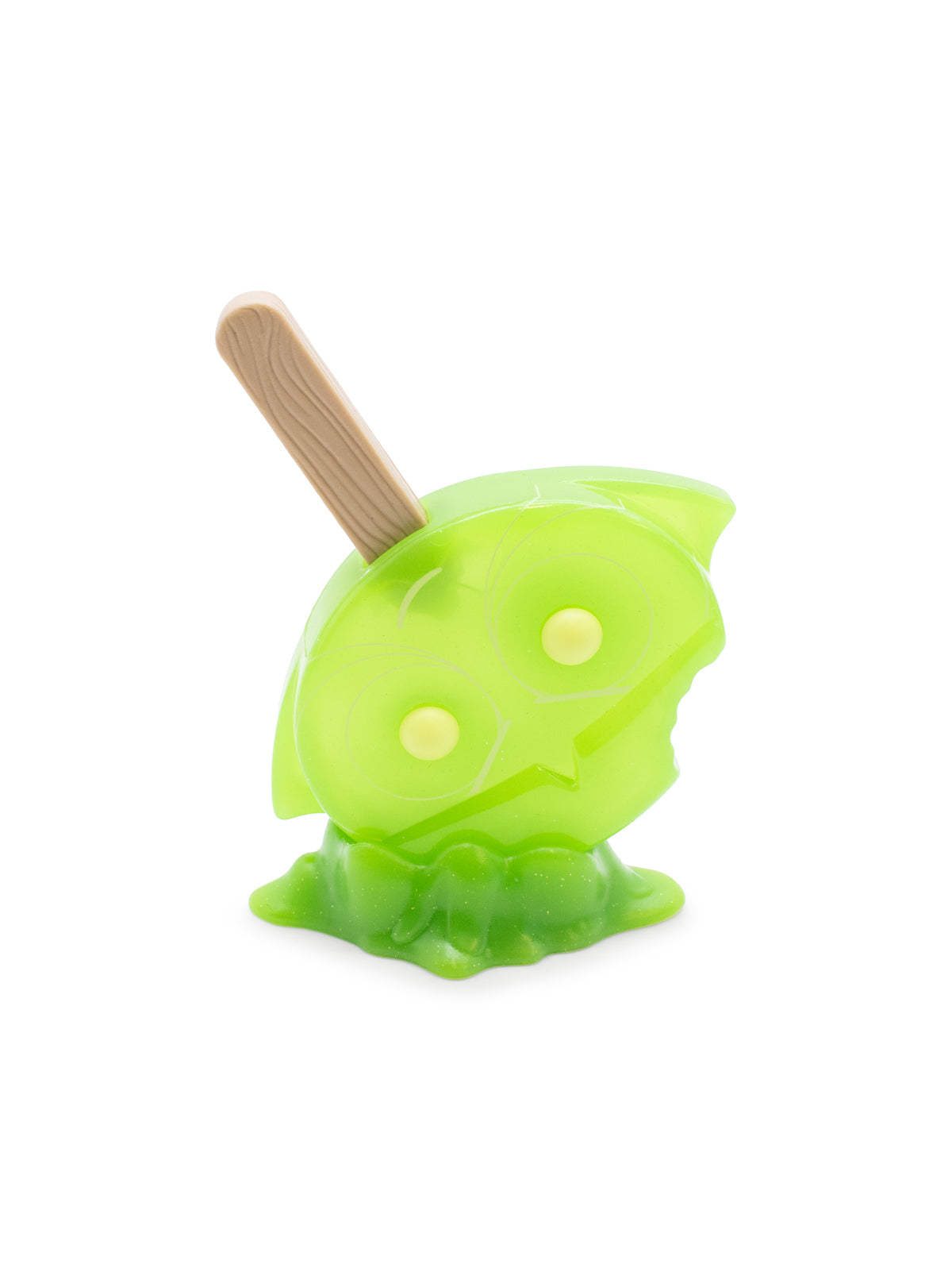 Green toy with a wooden stick on a white background