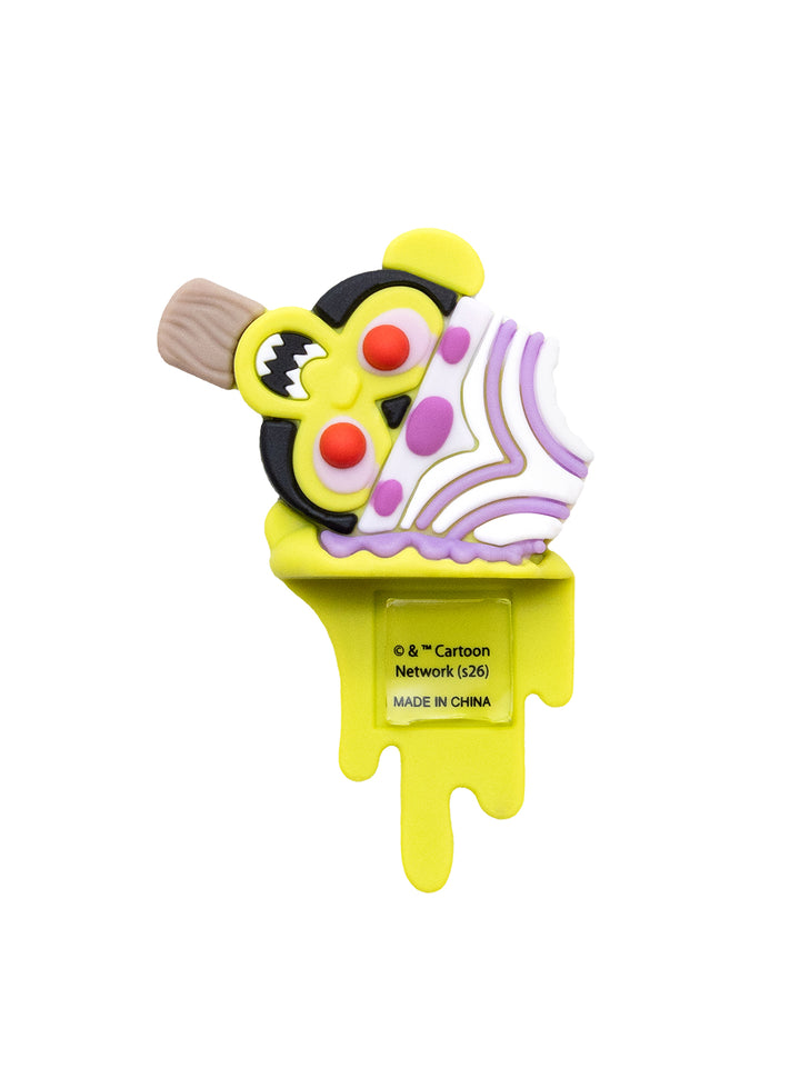 A novelty ice pop shaped like the Cartoon Network logo, featuring a bright yellow body with dripping details, a black and yellow circular emblem, red eyes, and a white swirl pattern with purple accents on the top, set against a plain white background.
