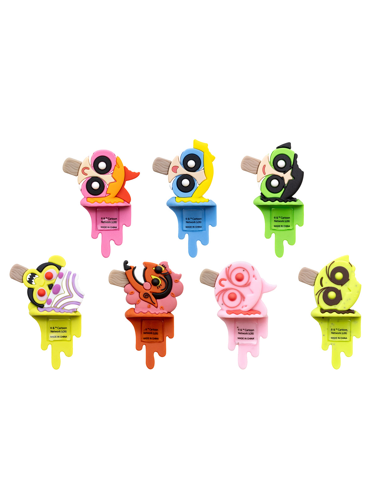 Seven colorful, novelty ice pop-shaped items arranged on a plain white background. Each has a different bright color scheme with cartoonish eyes and melting-edge shapes.
