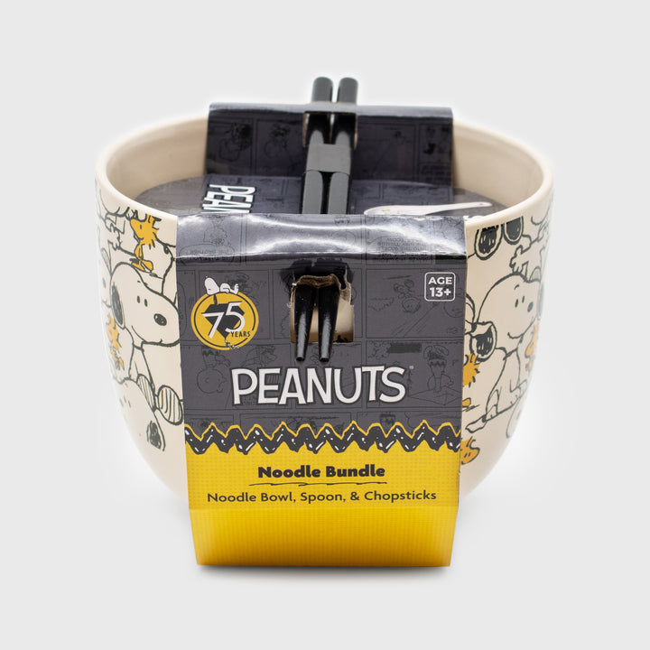 ramen bowl packaging. text: peanuts 75 years. age 13+. noodle bundle. noodle bowl, spoon, & chopsticks