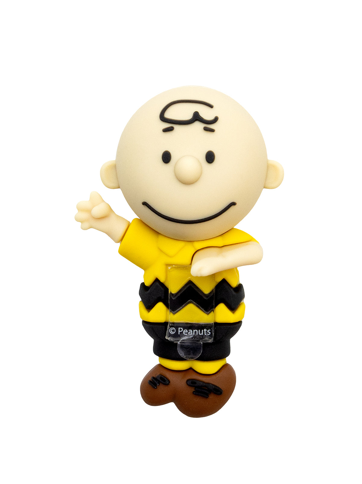 A Charlie Brown collectible figure from Peanuts, featuring the character in his signature yellow shirt with a black zigzag pattern, black pants, and brown shoes, set against a plain white background.