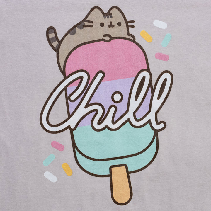 image on shirt: pusheen (gray cat), laying on top of a popsicle. sprinkles around image. text: chill