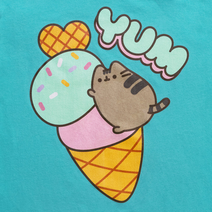 image on shirt: pusheen on top of ice cream cone. ice cream has a waffle heart on top, one scoop of ice cream with sprinkles, and another scoop on top of cone. text: yum
