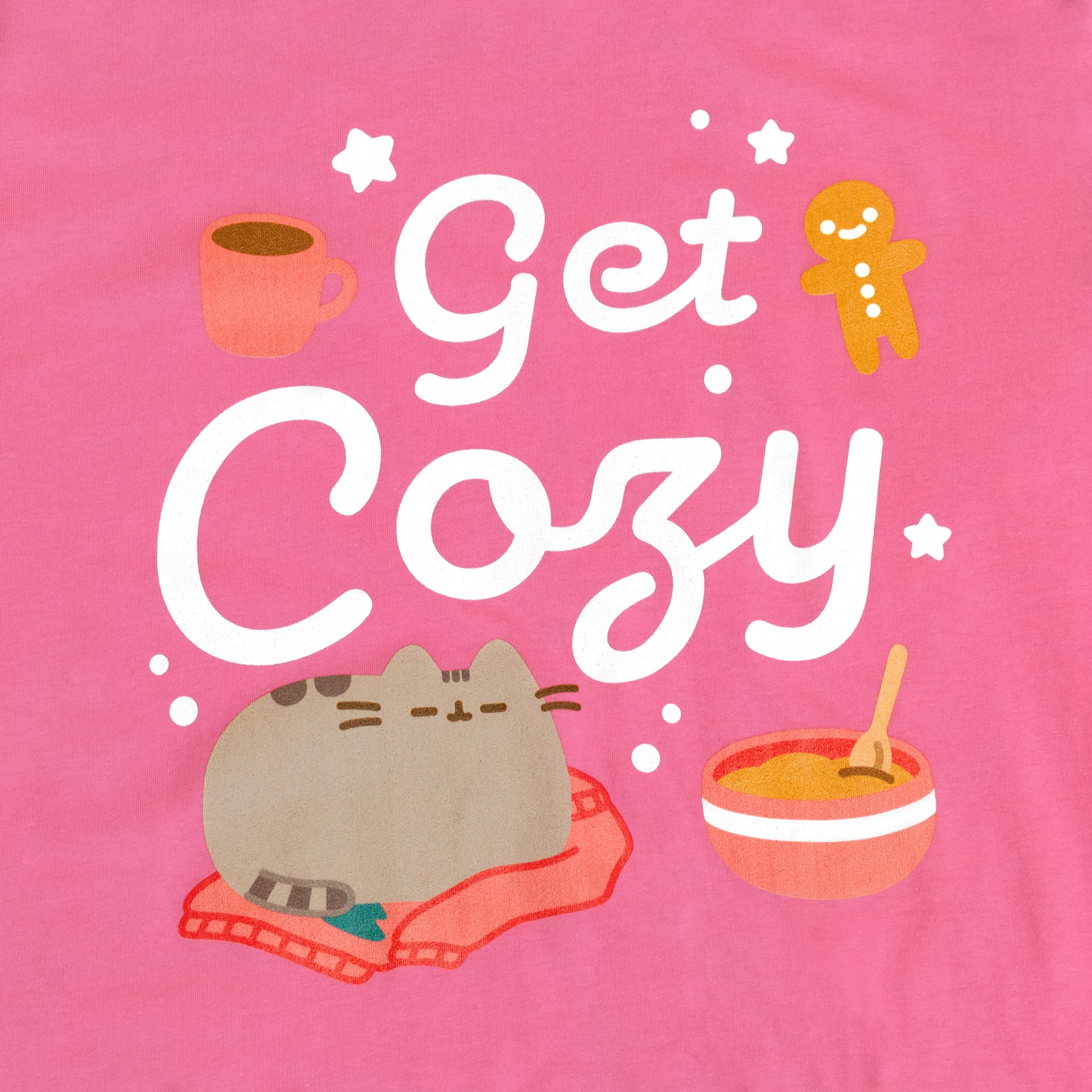 image on shirt: pusheen sleeping on sweater. mixing bowl with mix inside. gingerbread man cookie. mug. stars. text: get cozy 