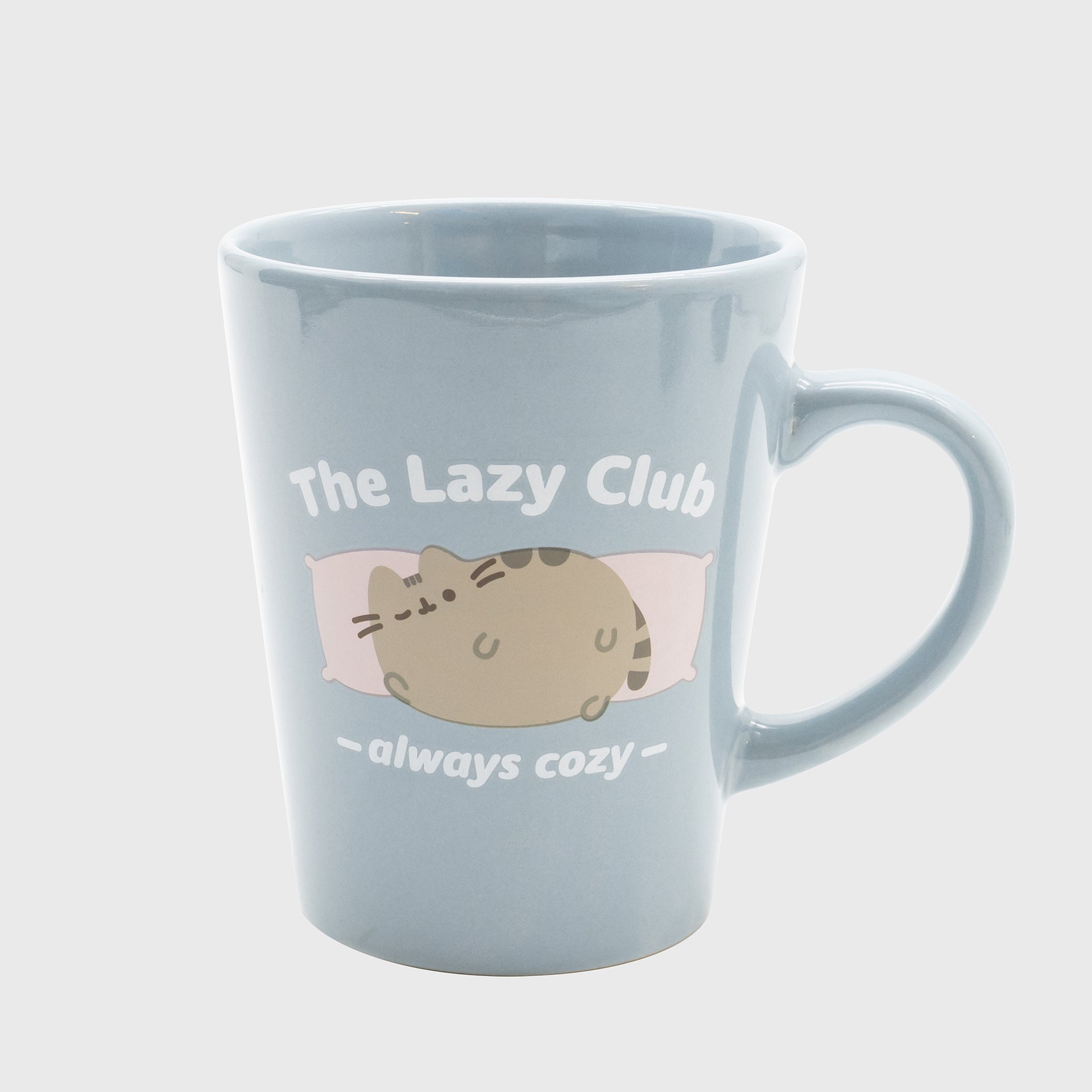 pusheen mug. pusheen laying on two pillows. text: the lazy club always cozy