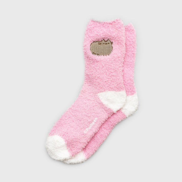 pusheen fuzzy sockk. pusheen sleeping on top.