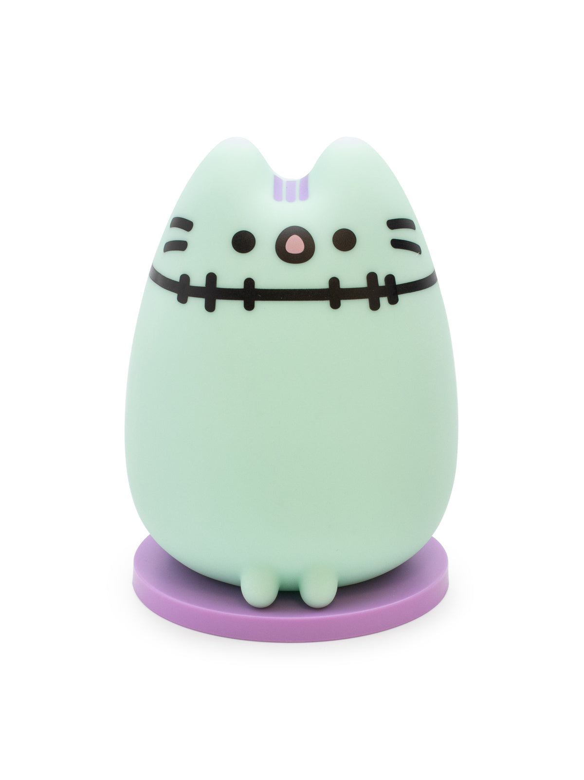 A cute, egg-shaped character figurine in a pale mint green color with purple accents and black stitched facial features, standing on a round purple base against a white background.