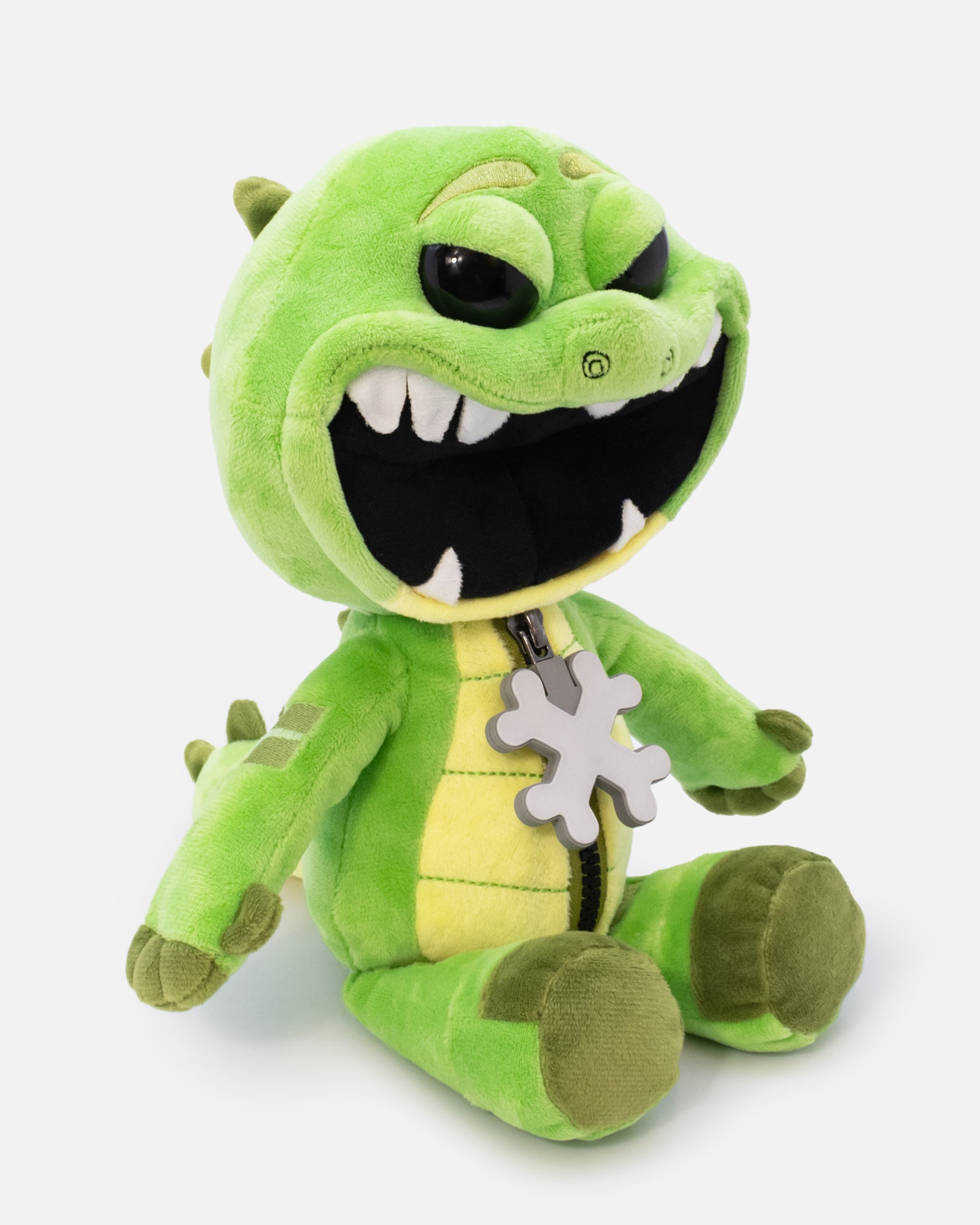 Green plush toy with a smiling face on a white background