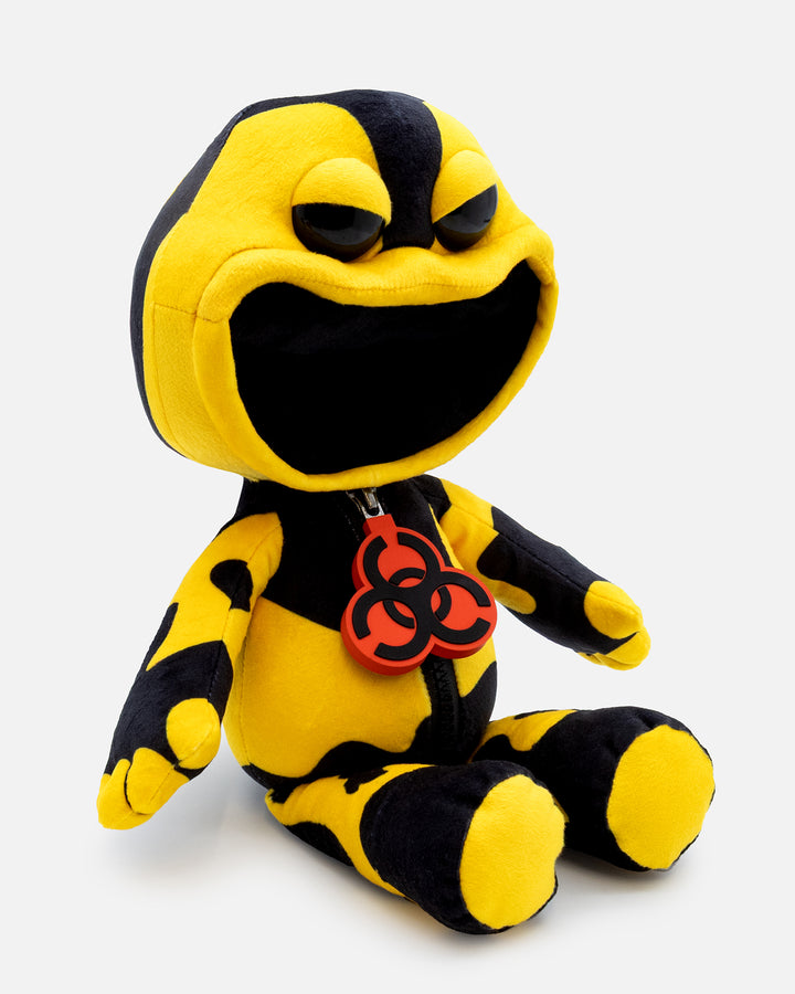 Yellow and black plush toy with biohazard symbol on a white background