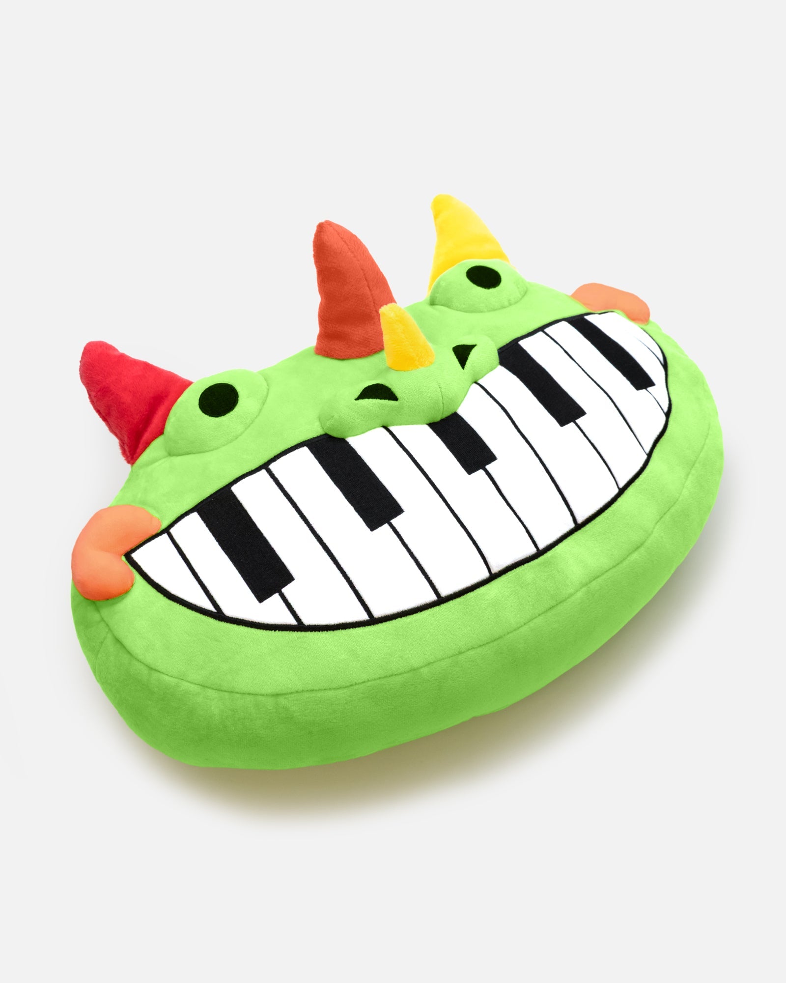 pianosaurus pillow plush laying down