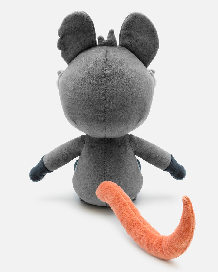 Gray plush toy with orange tail on a white background
