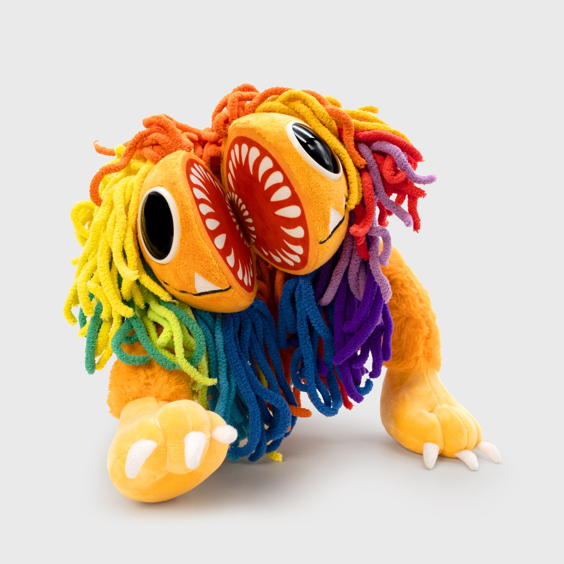yarnaby plush walking forward with mouth open