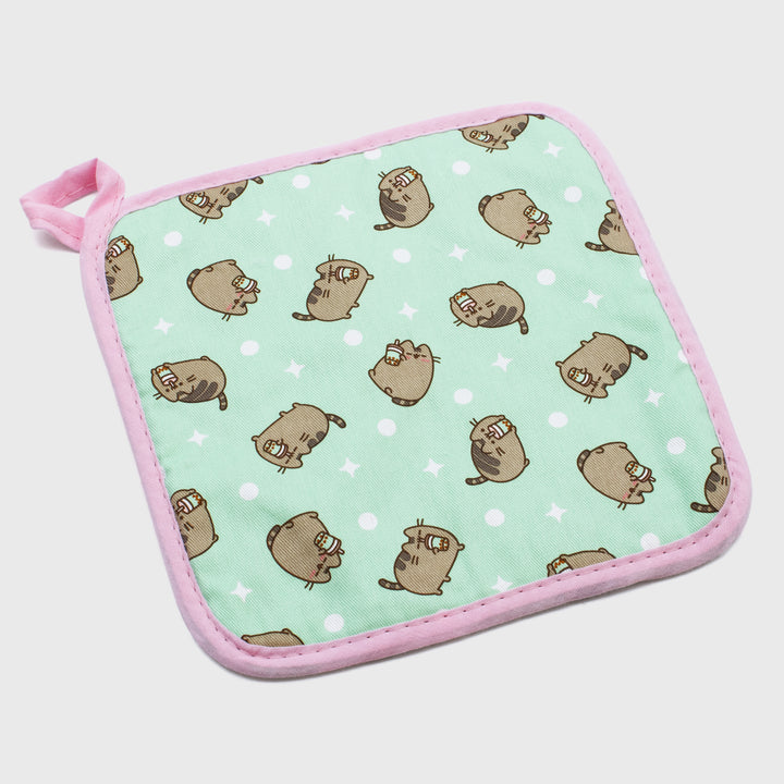 pusheen pot holder. design: pattern of pusheen holding boba tea and sipping boba tea. circles and stars.