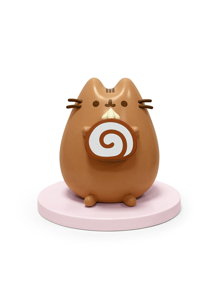 Brown cat-shaped figure with a white spiral design on a pink base against a white background