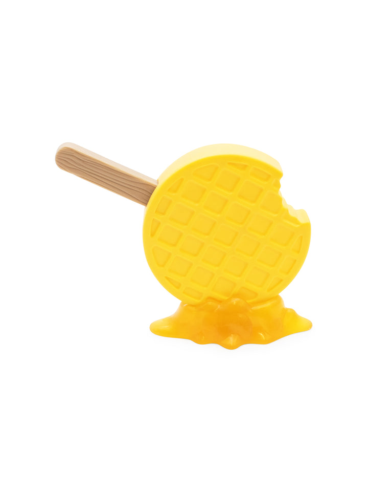 Yellow waffle ice cream toy with a wooden stick on a white background