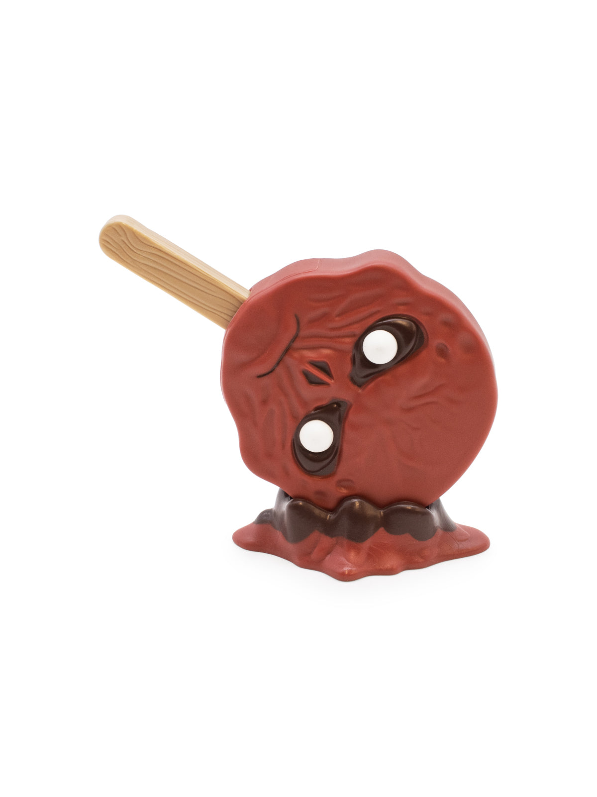 Red toy with angry face with a stick on a white background