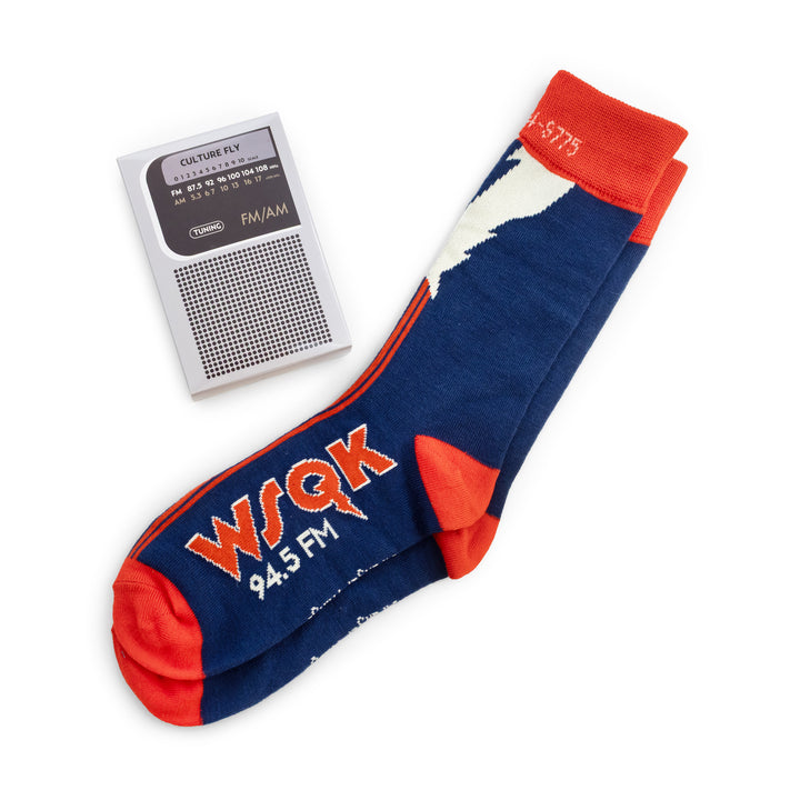 Blue sock with red accents and 'WSQK 94.5 FM' text next to a small radio on a white background