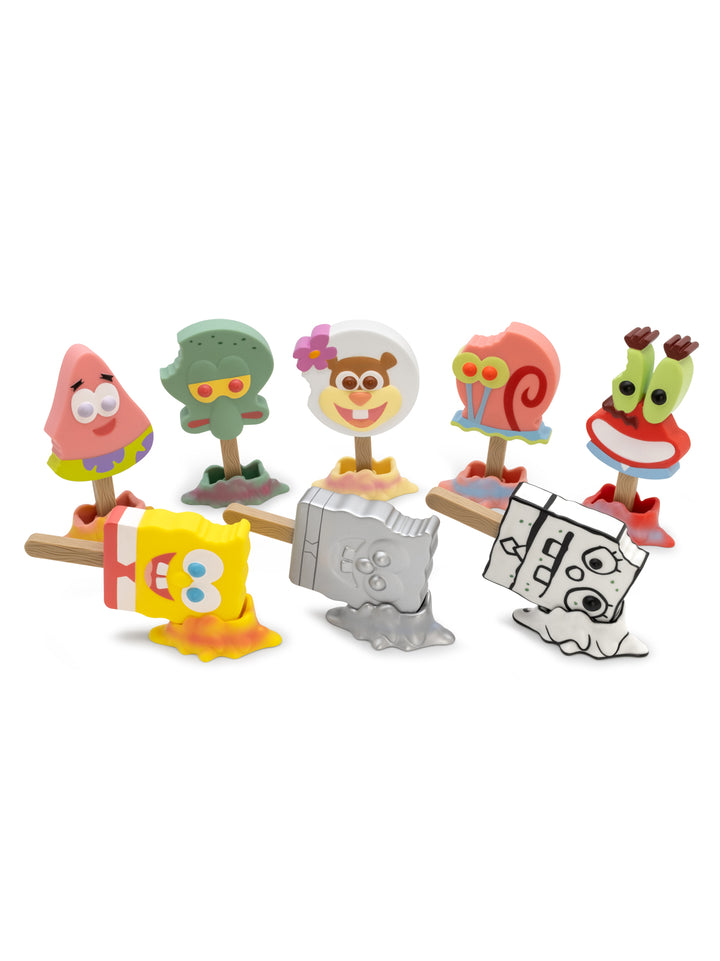 Set of colorful cartoon character figurines on a white background