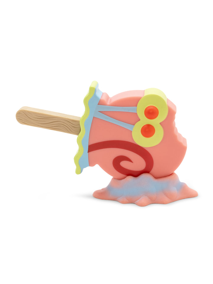 Colorful toy figure of a character with a shell on a white background