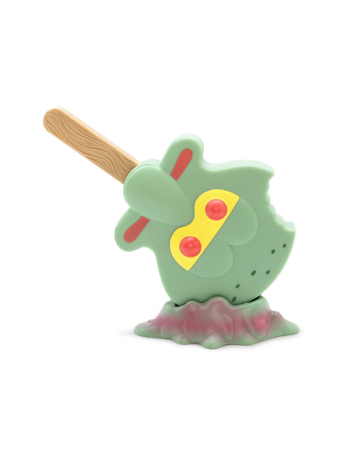 Toy resembling a squidward ice cream with a wooden stick on a white background