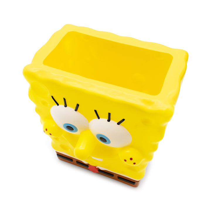 Yellow container shaped like a character on a white background