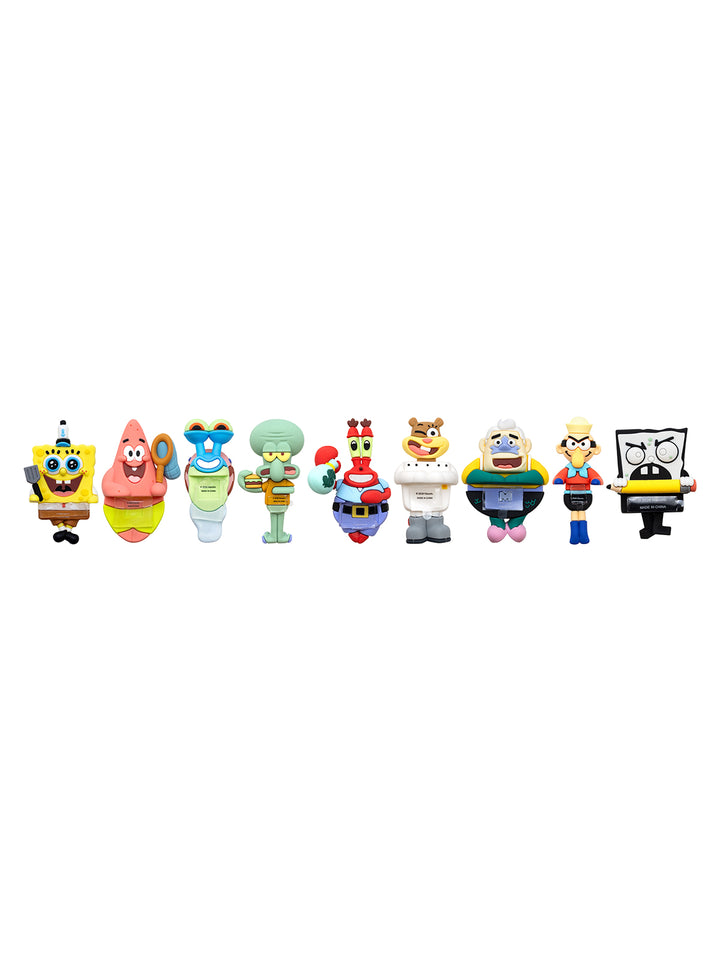 A row of nine SpongeBob SquarePants character figurines lined up horizontally against a plain white background.