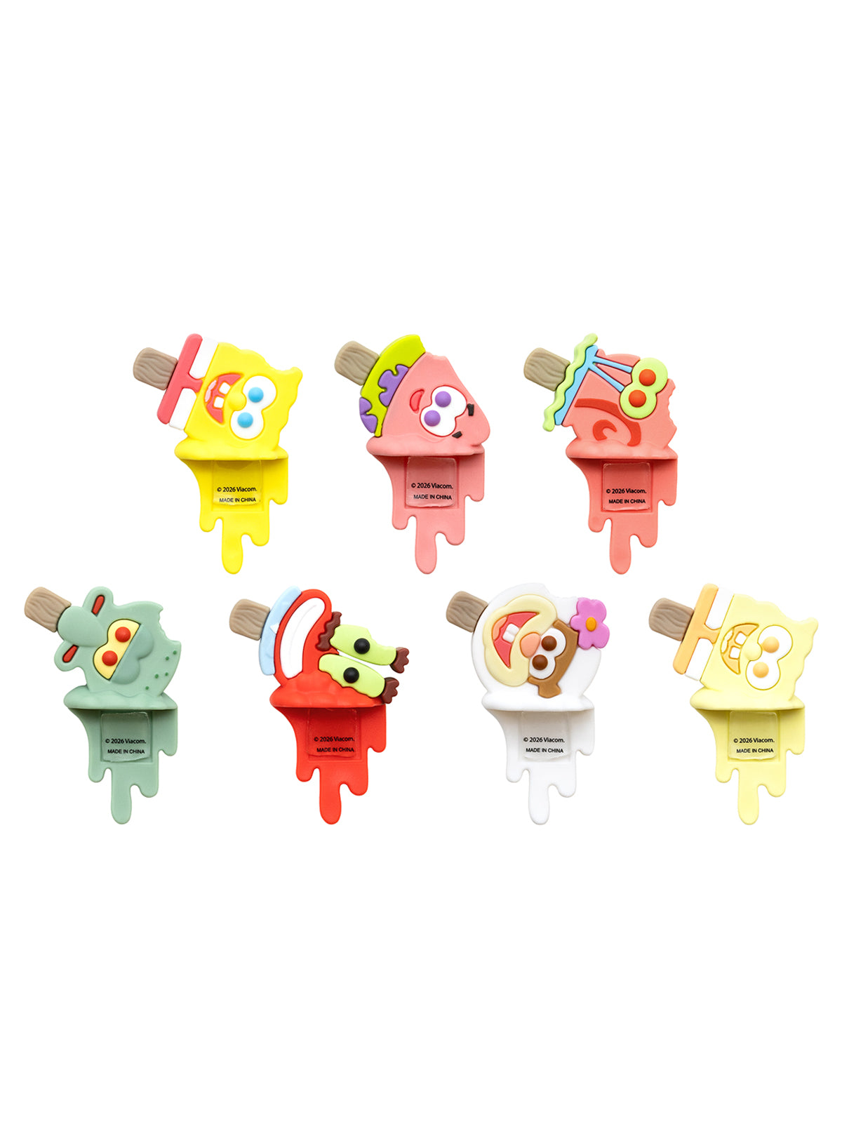 Six colorful cartoon popsicle-shaped accessories arranged on a plain white background, each with a different character design and pastel color scheme.
