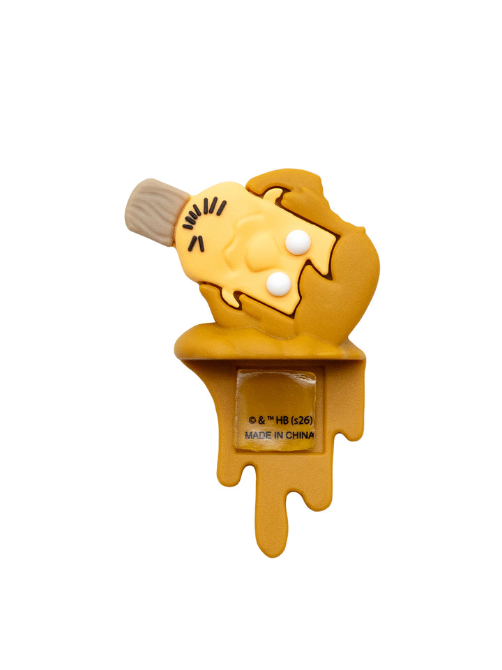 A figure shaped like a melting ice cream cone, featuring a yellow body, a brown stick, and white ice cream droplet