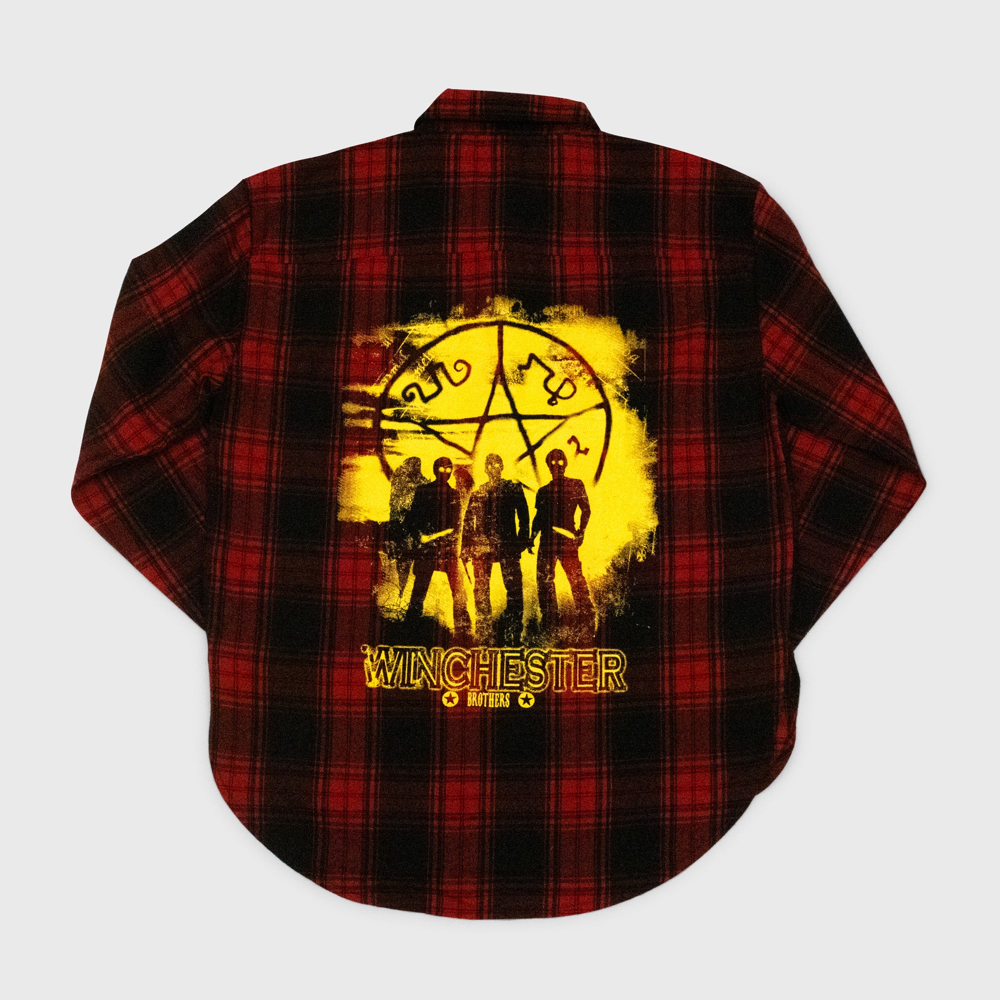 plaid shirt back. image: 3 men with pentagram symbol. text: winchester brothers