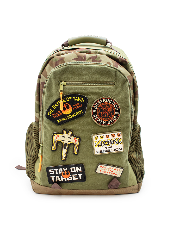 Green backpack with patches on a white background