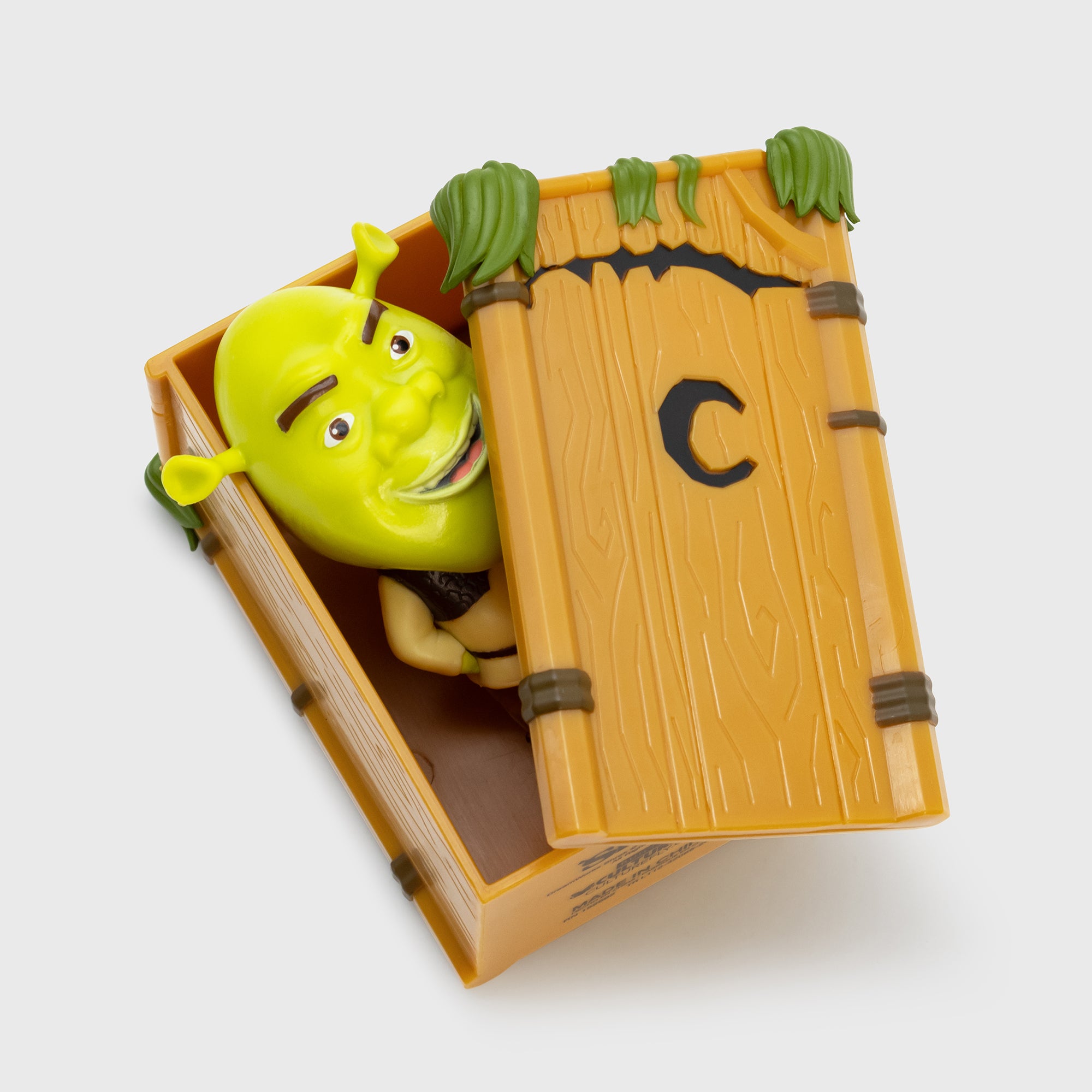 shrek peeking out of blind box case
