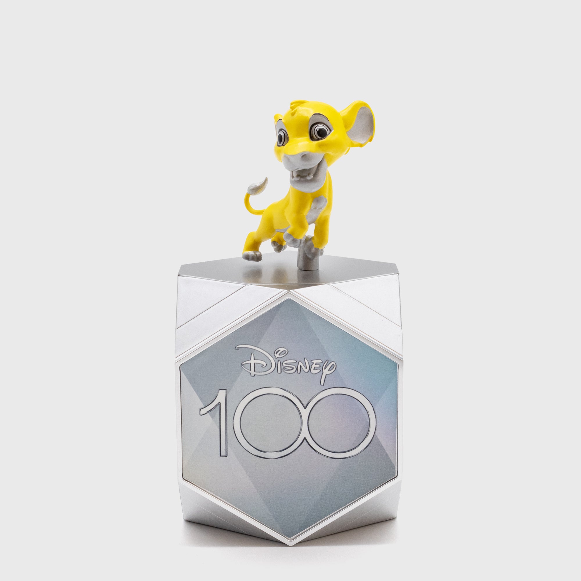 simba on top of disney100 box