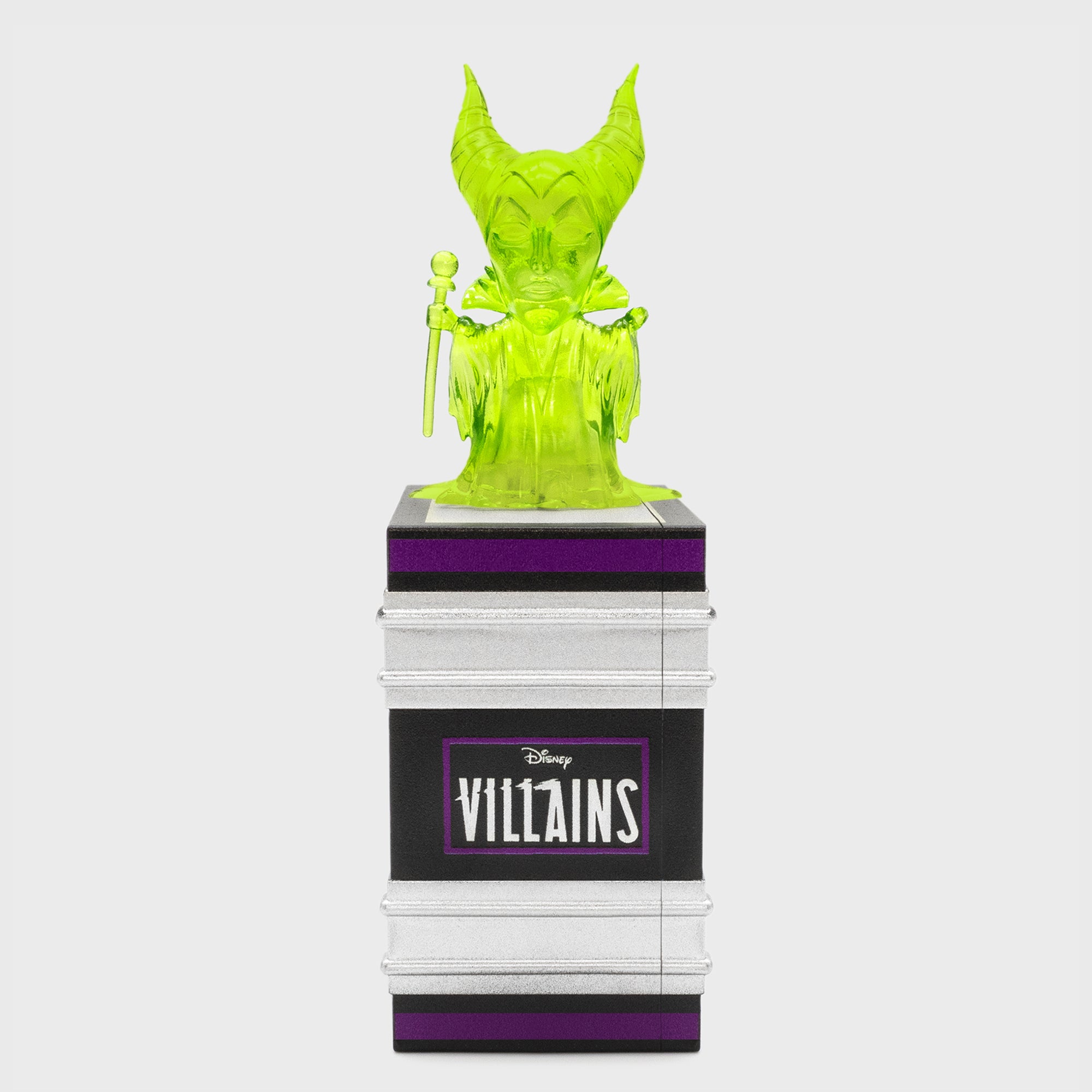 green maleficent chase on top of book