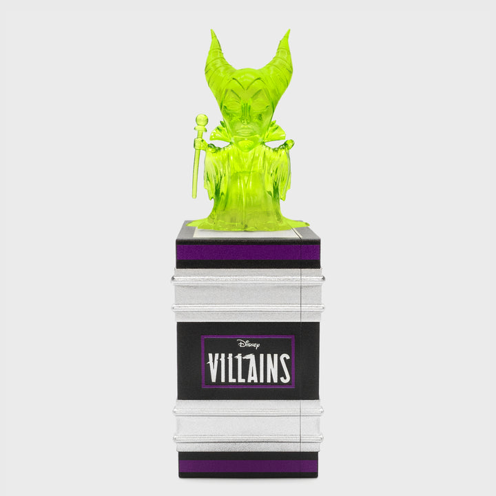 green maleficent chase on top of book