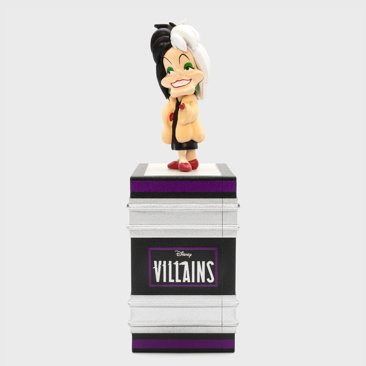 cruella de vil on top of book