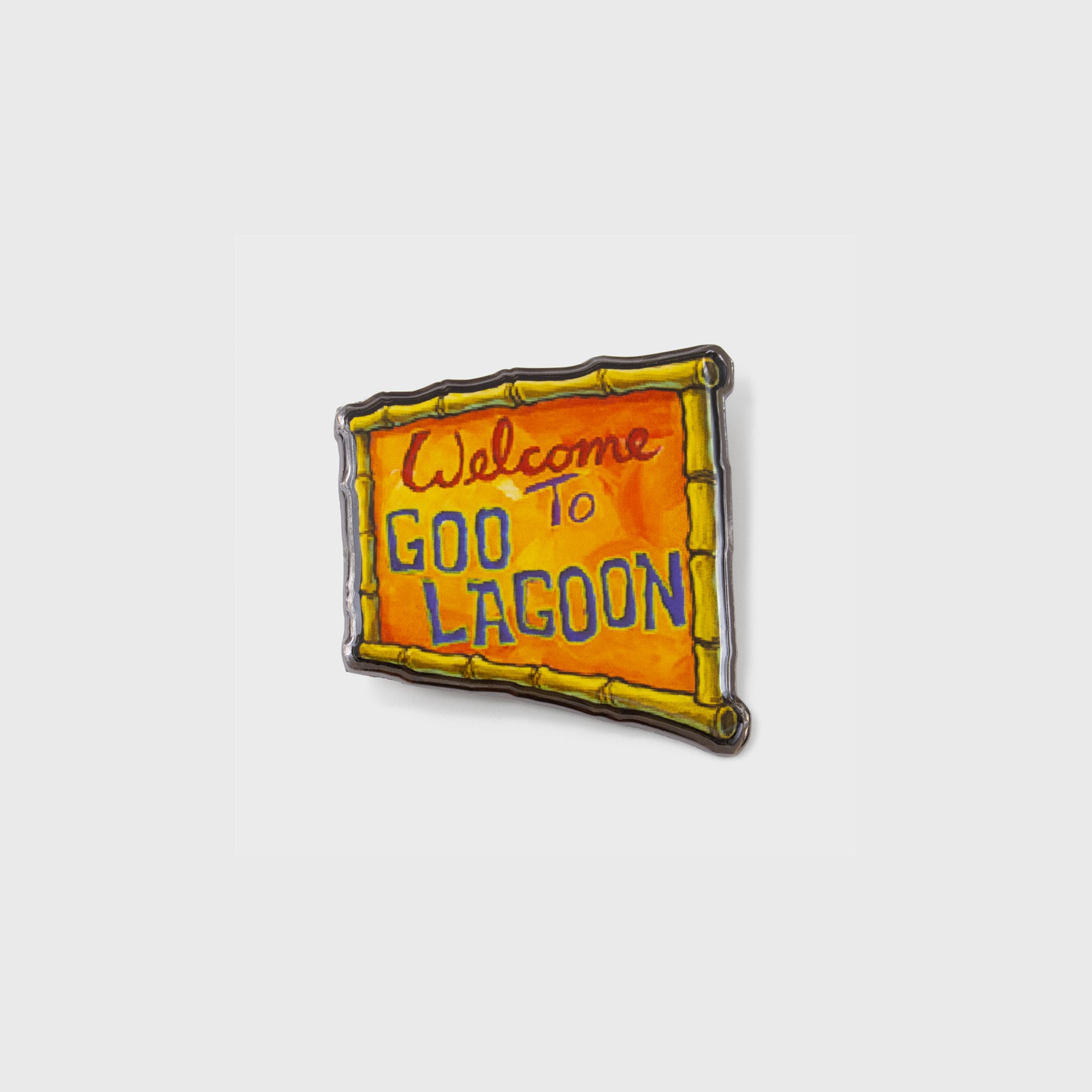 spongebob squarepants pin. image: welcome to goo lagoon sign.