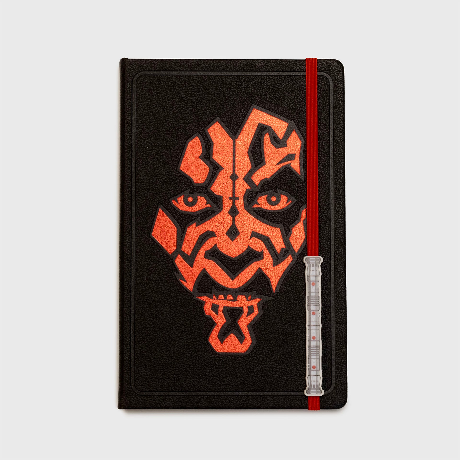 darth maul's face on cover of notebook. red lightsaber elastic bookmark with charm.
